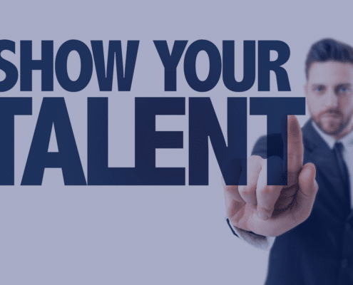 A confident temporary employee pointing to the text 'Show Your Talent' signifying the importance of showcasing skills in the workplace, aligned with Measured Ability's advice for making a lasting impression.