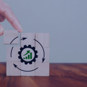 Hand placing the final piece in a puzzle depicting a gear with a growth graph, representing the continuous process of staffing and navigating the job market dynamics in South Africa.
