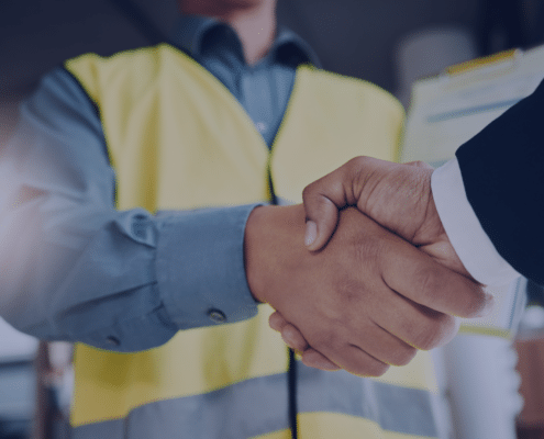 Engineering recruitment handshake symbolizing the successful hiring of top talent in a competitive market for Measured Ability.
