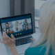 A woman participating in an online consulting meeting with multiple colleagues, reflecting the shift towards remote work in the consulting industry.