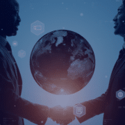 Two business professionals shaking hands in silhouette with a digital globe in the background, symbolizing the global impact of sustainable recruitment practices.