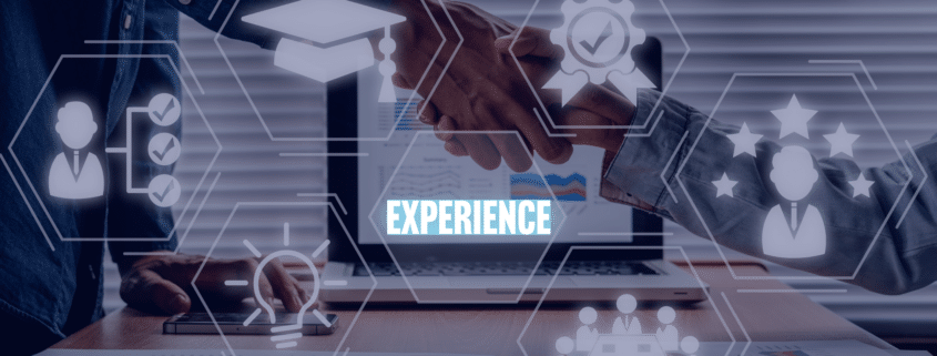 Two professionals shaking hands, with virtual icons representing skills and experience, encapsulating the strategy to bridge the experience gap for new graduates."