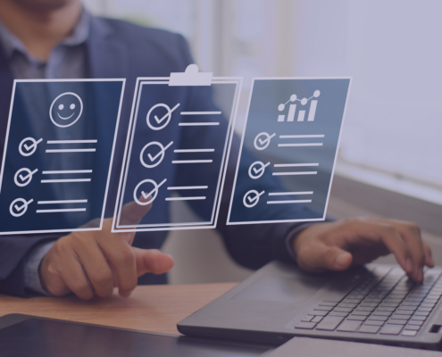 Business professional using a laptop with virtual checklists, symbolizing the role of payroll services in enhancing employee satisfaction through efficient task management.